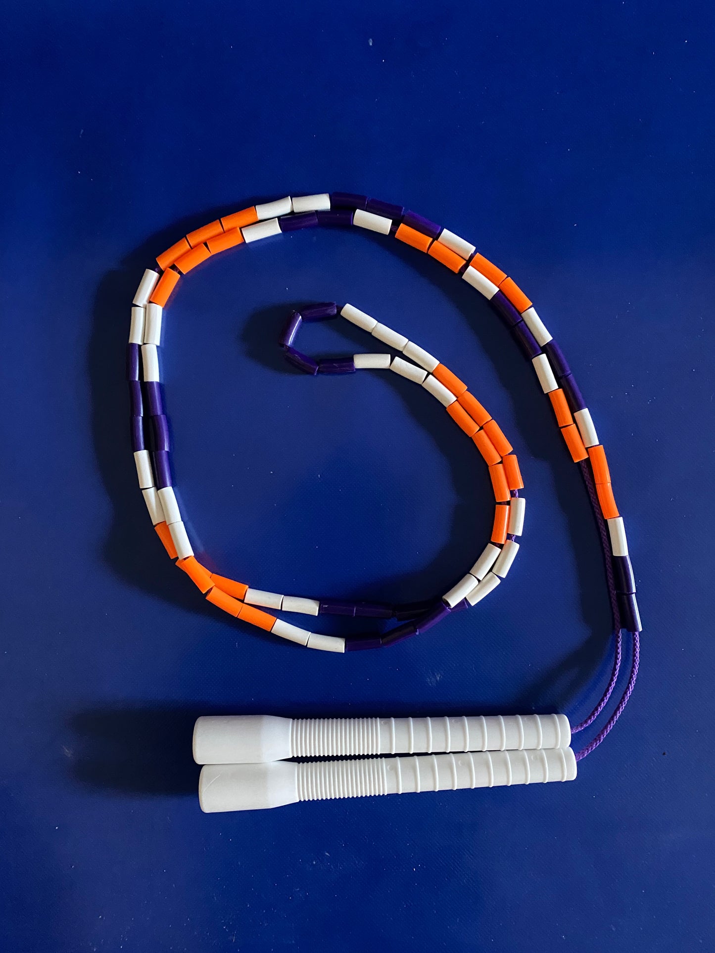 Beaded rope met long handles