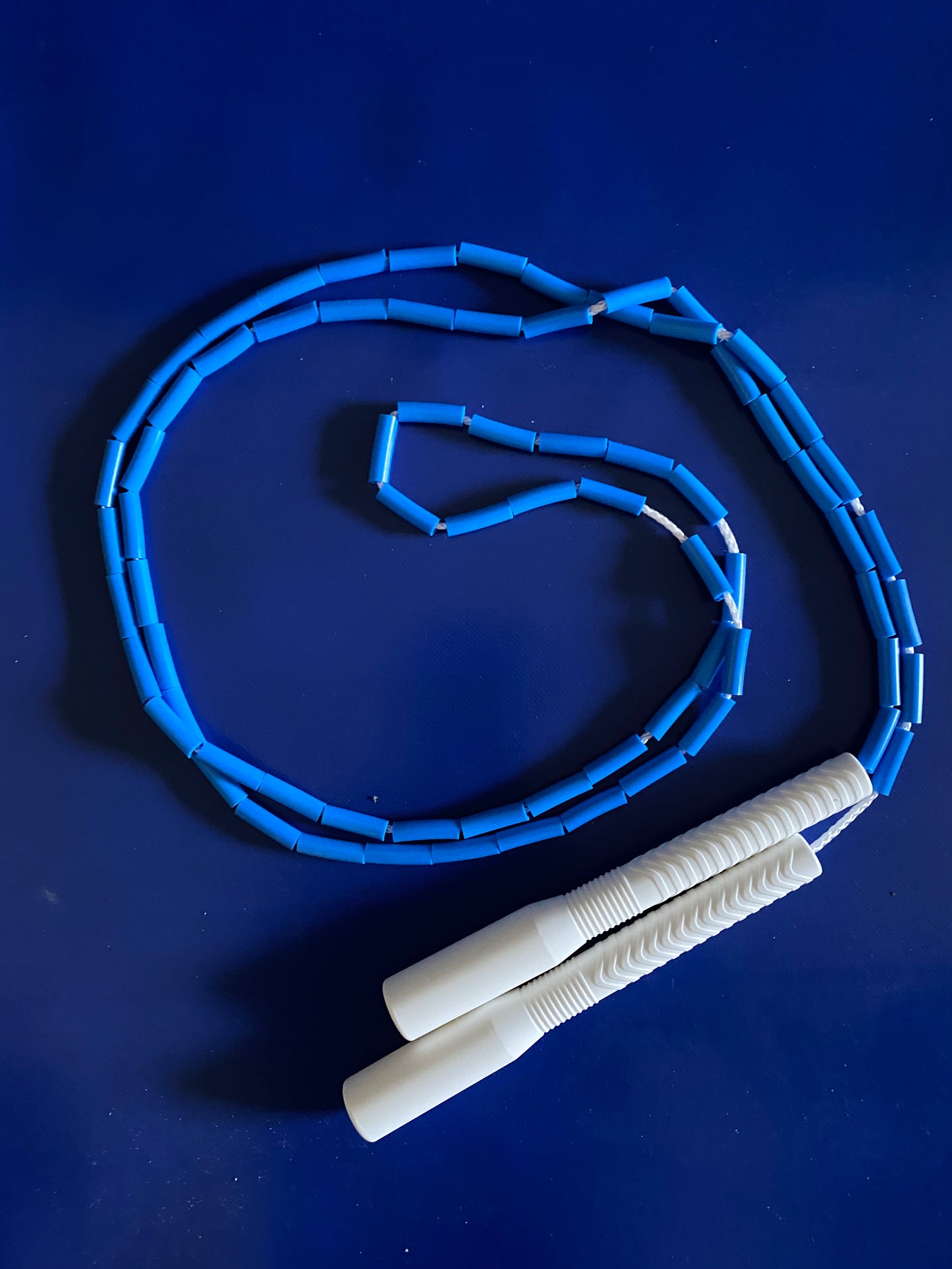 Beaded rope met long handles